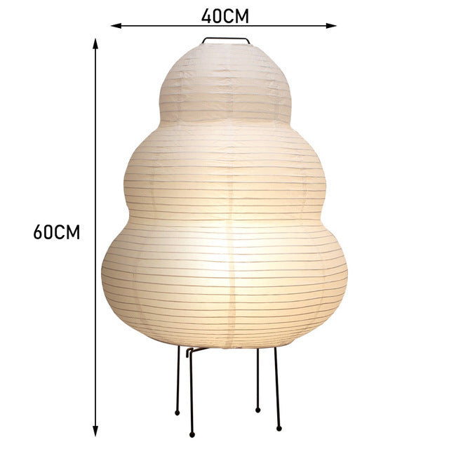 Beige lamp with dimensions indicated on a white background